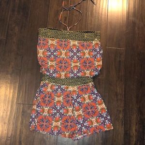 Small Multi colored sleeveless romper.worn once - like new.